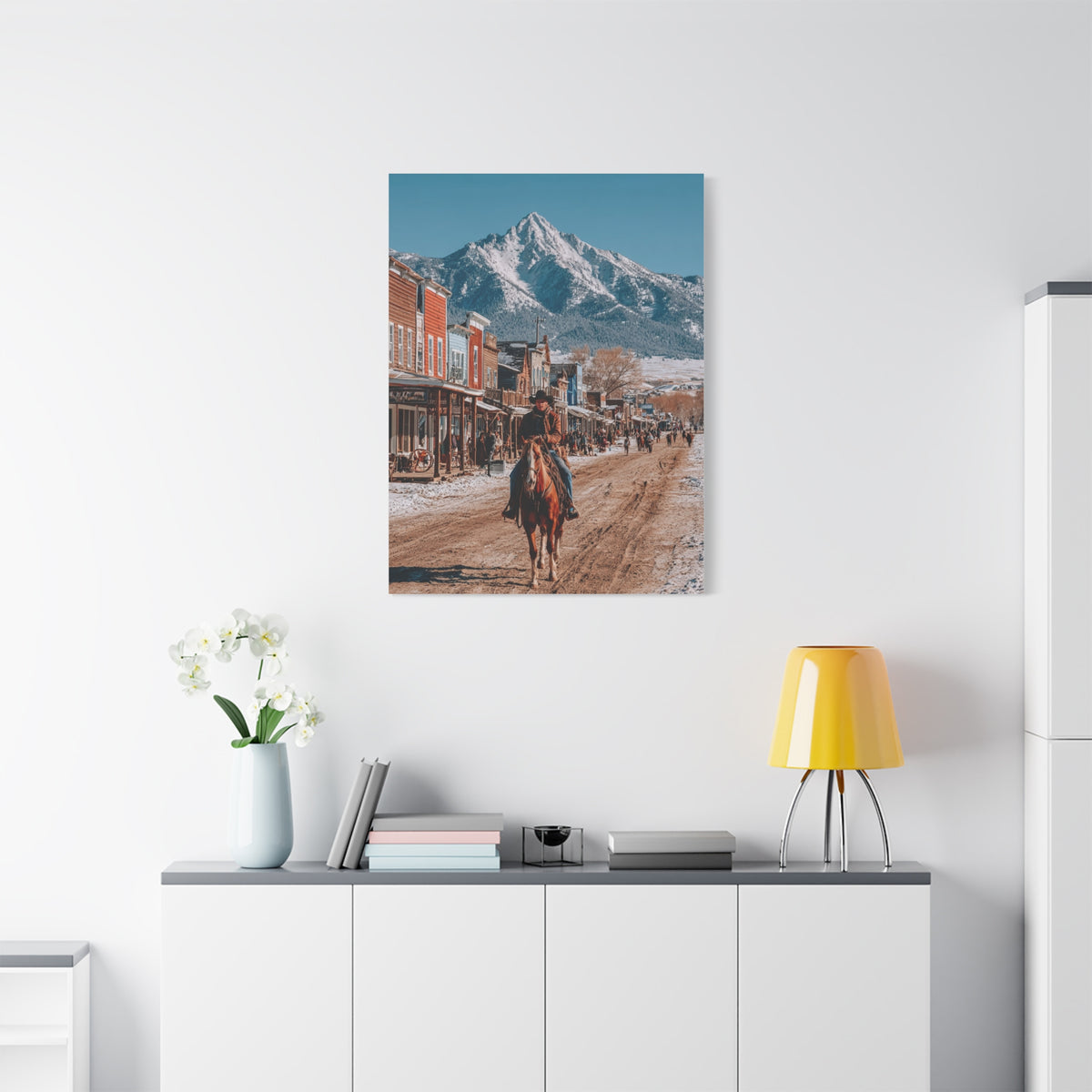 Cowboy Riding Through a Frontier Mountain Town Wall Art & Canvas Print