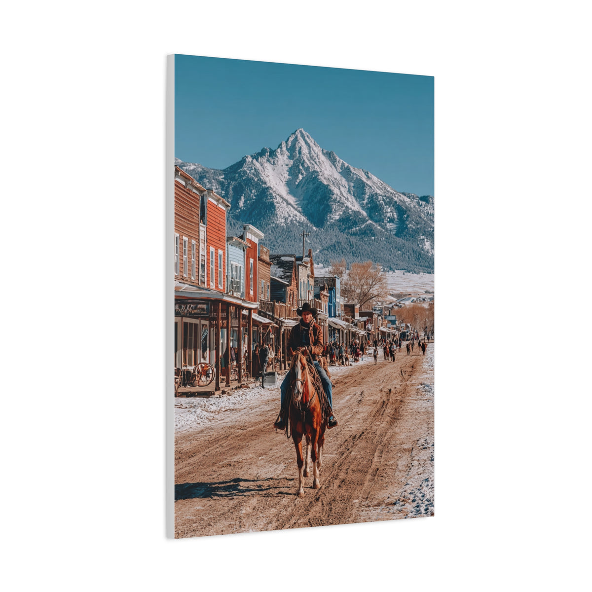 Cowboy Riding Through a Frontier Mountain Town Wall Art & Canvas Print