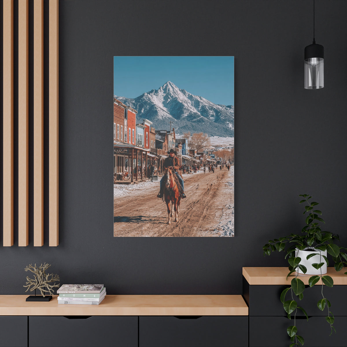 Cowboy Riding Through a Frontier Mountain Town Wall Art & Canvas Print