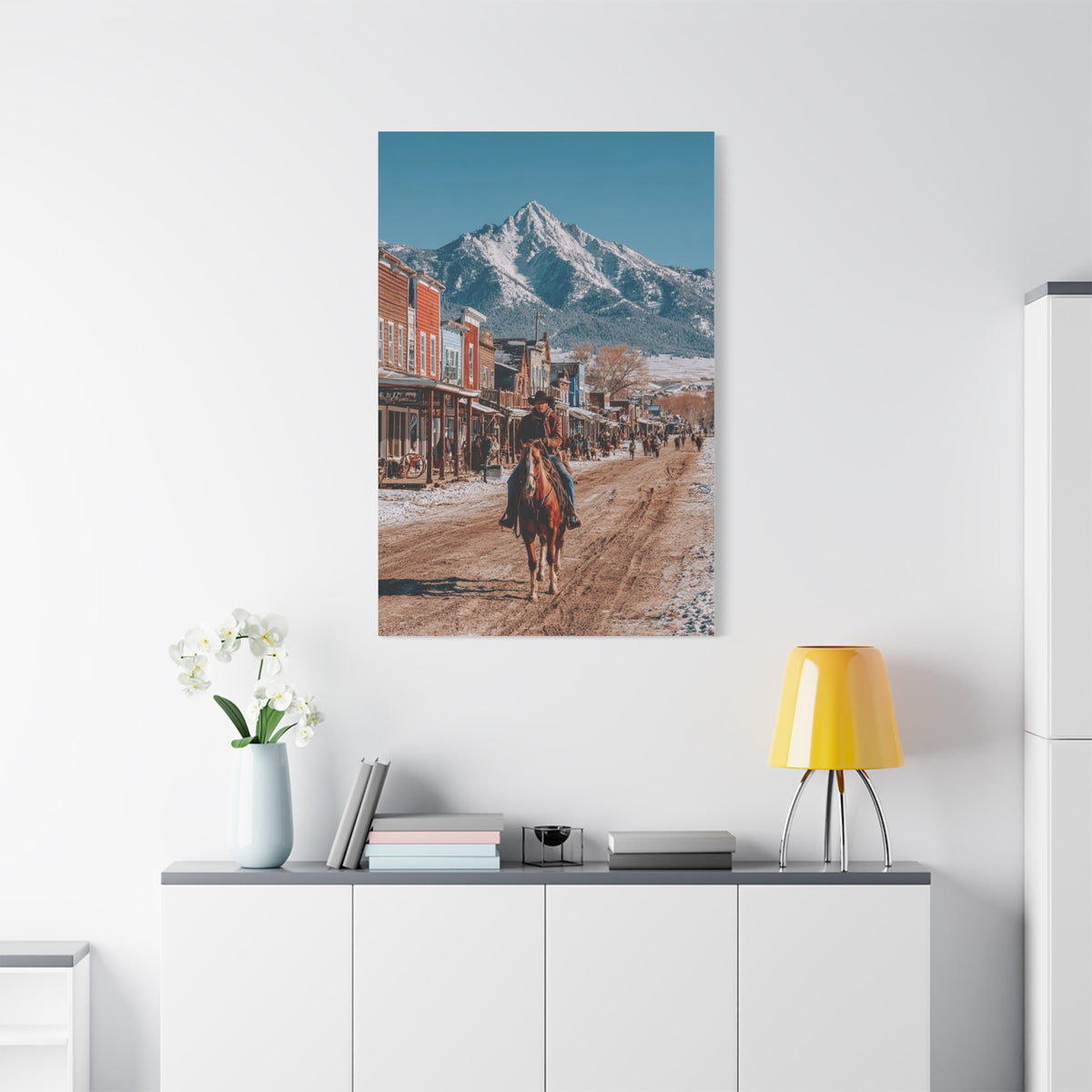 Cowboy Riding Through a Frontier Mountain Town Wall Art & Canvas Print