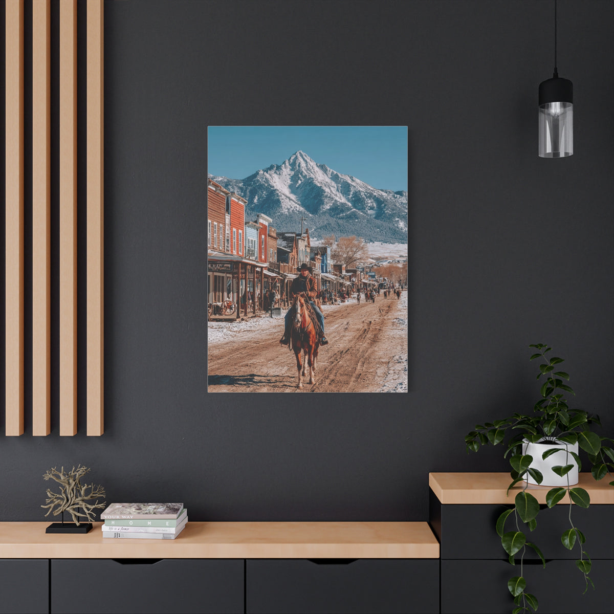 Cowboy Riding Through a Frontier Mountain Town Wall Art & Canvas Print