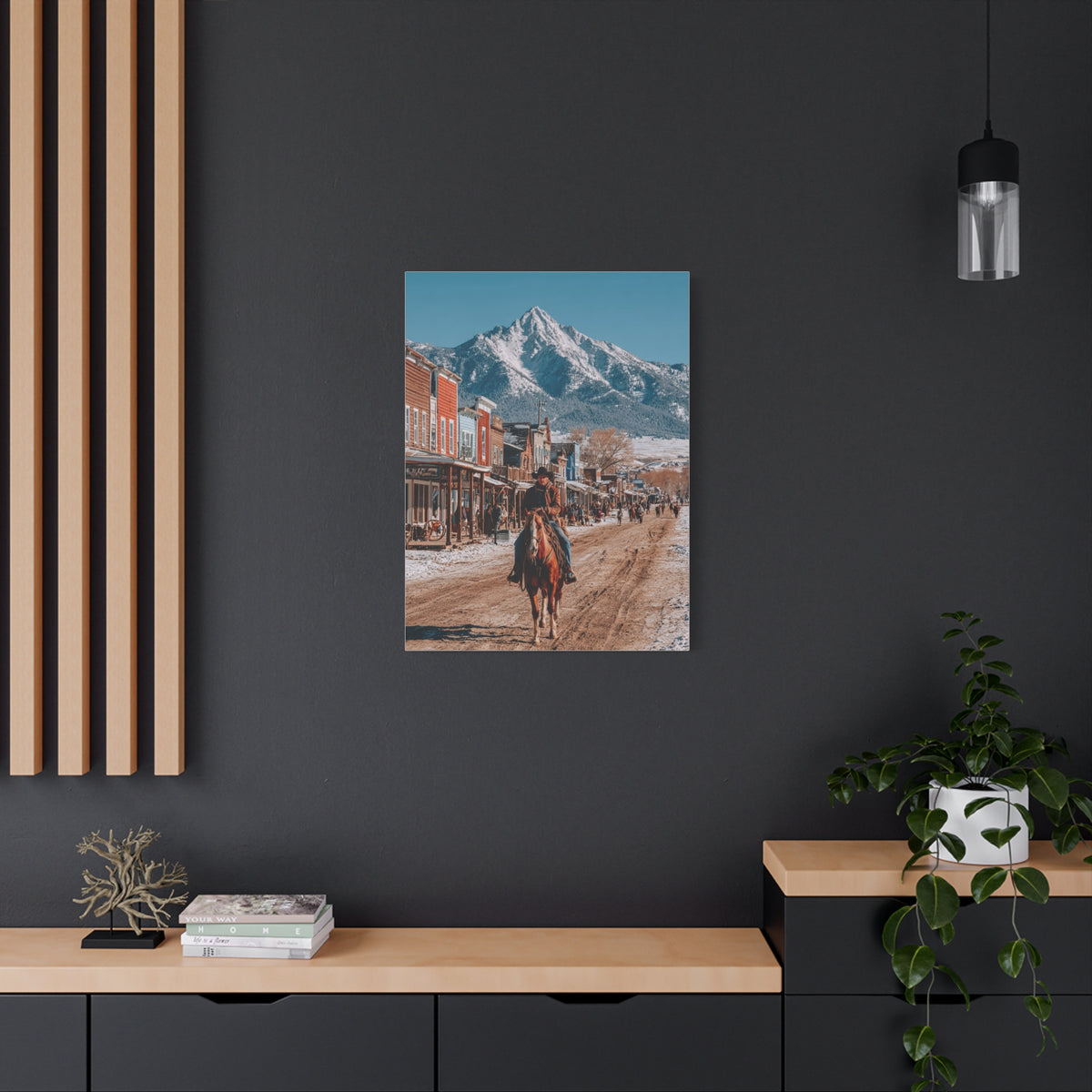 Cowboy Riding Through a Frontier Mountain Town Wall Art & Canvas Print