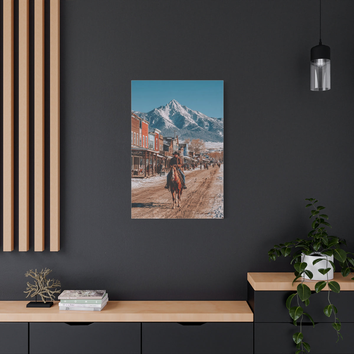 Cowboy Riding Through a Frontier Mountain Town Wall Art & Canvas Print